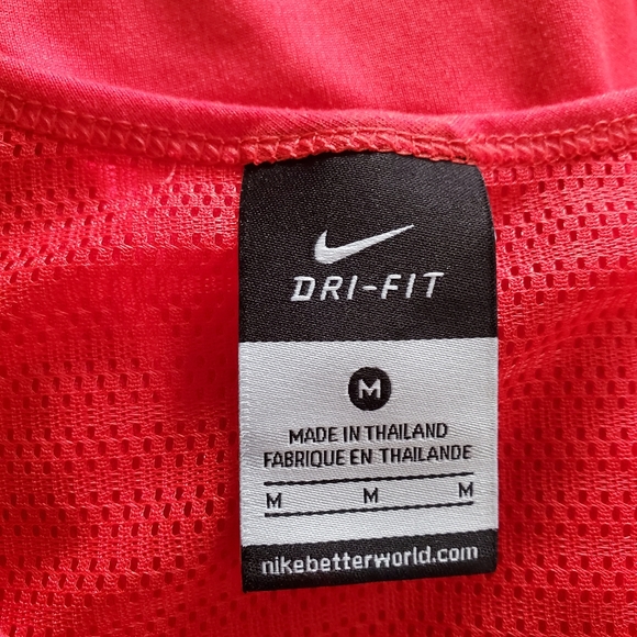 NIKE Dri-Fit Workout T with Mesh Paneling in Melon Red. - Picture 6 of 8